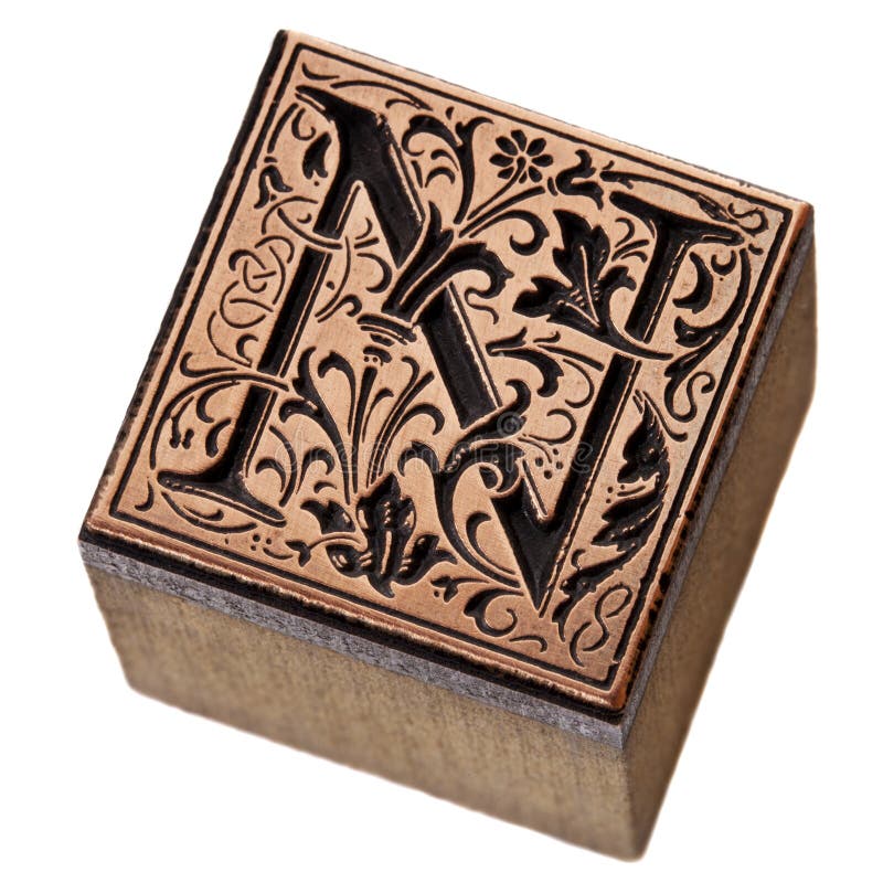 Ornamental initial letter N - copper and wood vintage letterpress printing block. Metal n stock images, royalty-free photos and pictures