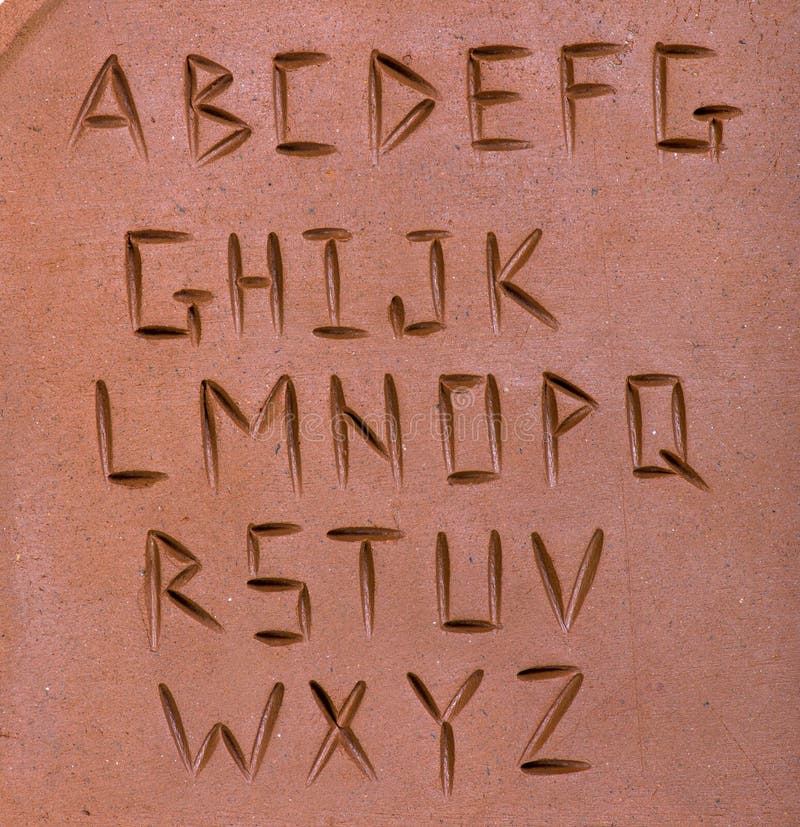Letters carved on clay stock photo. Image of carved, surface 47633974