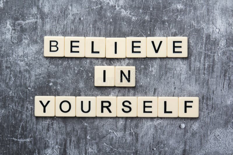 Letters forming a motivation phrase Believe in yourself stock photography