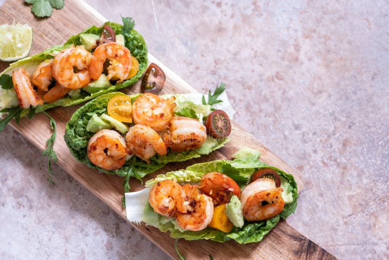 Lettuce Wrapped Shrimp Tacos with Fresh Tomato and Avocado Stock Image