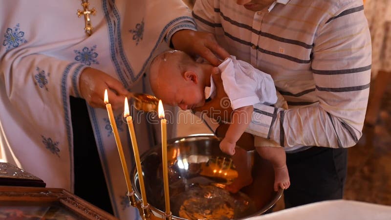 Letychiv, Ukraine - 10.15.2020: rite of sacrament epiphany child baby in church