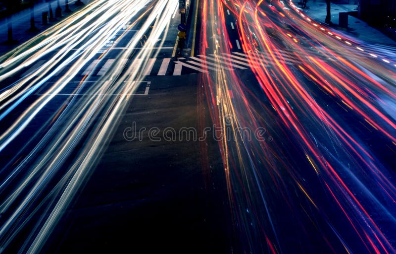 Car headlights at night in motion on a busy highway. Car headlights at night in motion on a busy highway