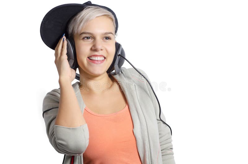 Leuk jong meisje die aan muziek op hoofdtelefoons luisteren royalty-vrije stock foto Leuk jong meisje die aan muziek op hoofdtelefoons luisteren royalty-vrije stock foto