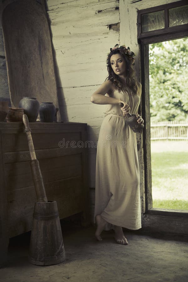 Cute woman with bare feet in the rural house. Cute woman with bare feet in the rural house
