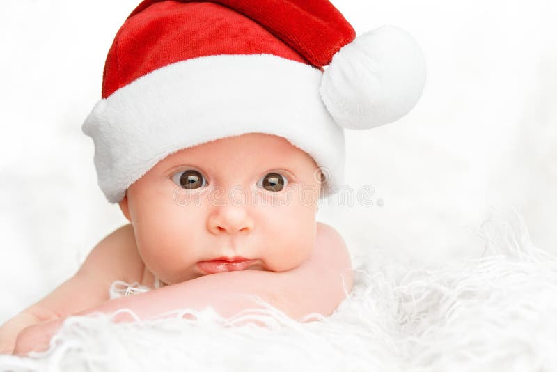 Leuke pasgeboren baby in Kerstmishoed royalty-vrije stock fotografie Leuke pasgeboren baby in Kerstmishoed royalty-vrije stock fotografie