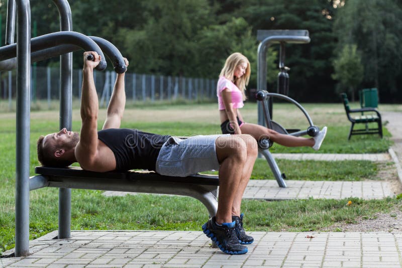 People training on the outdoor gym, horizontal. People training on the outdoor gym, horizontal