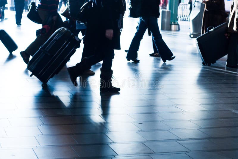 People traveling at the airport ( motion blur). People traveling at the airport ( motion blur)