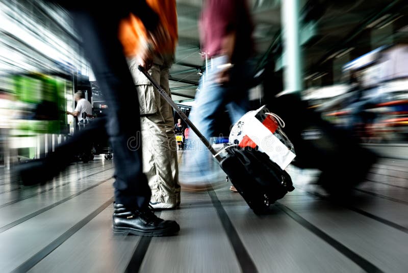 People traveling at the airport ( motion blur). People traveling at the airport ( motion blur)