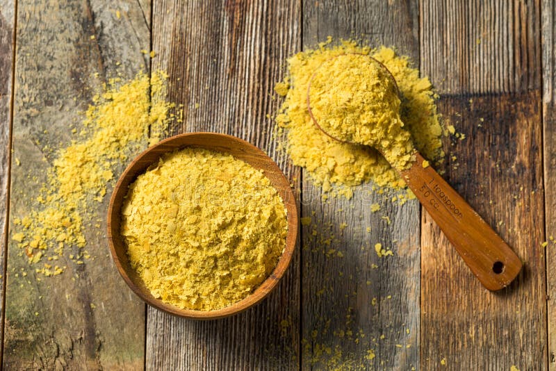 Raw Yellow Organic Nutritional Yeast in a Bowl. Raw Yellow Organic Nutritional Yeast in a Bowl