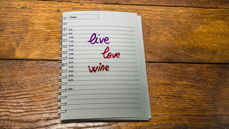 Live, love, wine. writing love text on paper, lovely message. Text on spiral agenda. Romantic, love concept. Valentine`s day. Live, love, wine. writing love text on paper, lovely message. Text on spiral agenda. Romantic, love concept. Valentine`s day