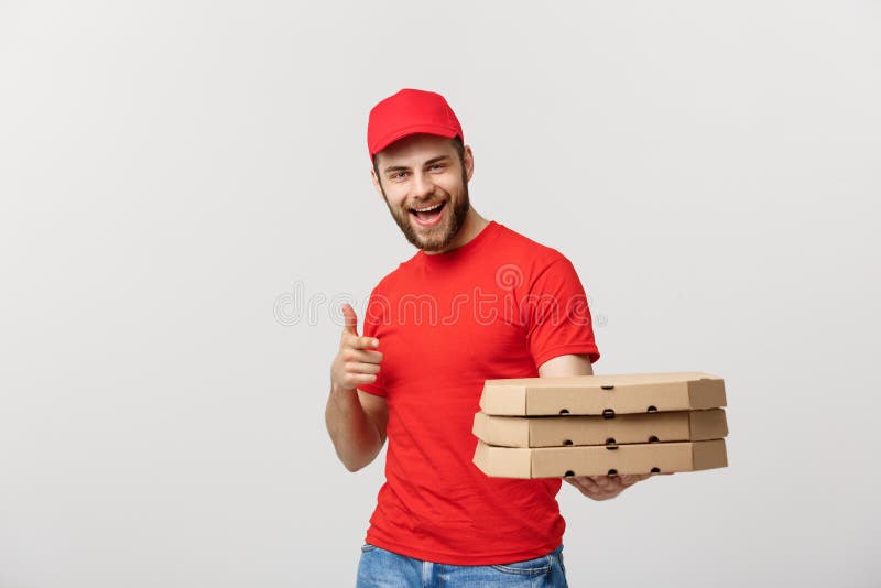 Leveringsconcept: De knappe Kaukasische mens die van de Pizzalevering vinger richten Geïsoleerdg over grijze achtergrond royalty-vrije stock afbeelding Leveringsconcept: De knappe Kaukasische mens die van de Pizzalevering vinger richten Geïsoleerdg over grijze achtergrond royalty-vrije stock afbeelding