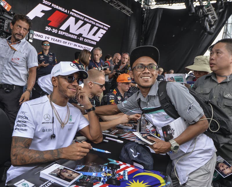 SEPANG, MALAYSIA : OCTOBER 01, 2017 :  Lewis Hamilton of Great Britain and Mercedes AMG Petronas F1 Team meet fans before the Malaysia Formula One F1 Grand Prix at Sepang International Circuit SIC. SEPANG, MALAYSIA : OCTOBER 01, 2017 :  Lewis Hamilton of Great Britain and Mercedes AMG Petronas F1 Team meet fans before the Malaysia Formula One F1 Grand Prix at Sepang International Circuit SIC