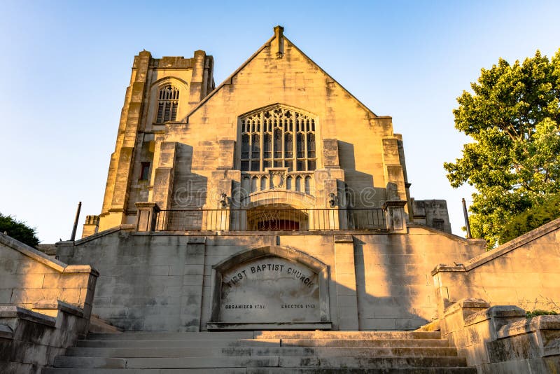 Lexington, Kentucky, USA - June 19, 2017: Point of view shot looking up the steps at First Baptist Church on Short Street with golden hour lighting. This congregation was first organized in 1786. Lexington, Kentucky, USA - June 19, 2017: Point of view shot looking up the steps at First Baptist Church on Short Street with golden hour lighting. This congregation was first organized in 1786.