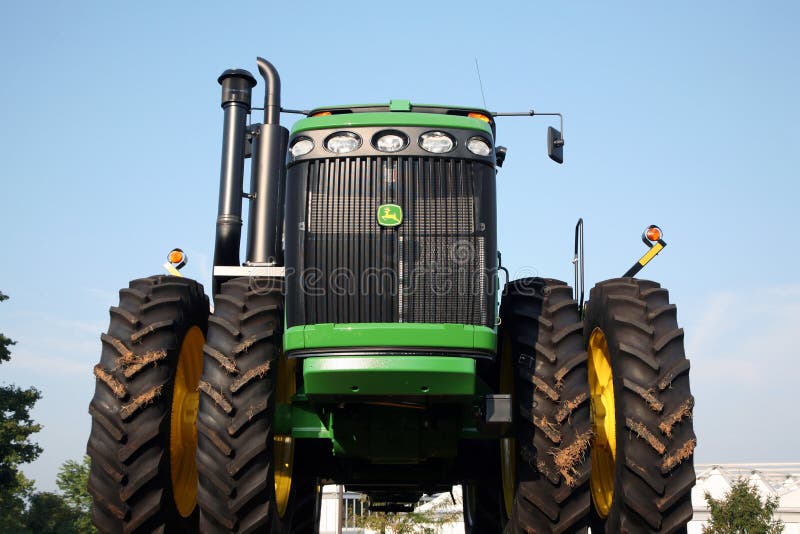 LEXINGTON, KY-CIRCA JANUARY, 2015: John Deere tractor on display. Large agribusinesses increasingly turn to large equipment like stock photos LEXINGTON, KY-CIRCA JANUARY, 2015: John Deere tractor on display. Large agribusinesses increasingly turn to large equipment like stock photos