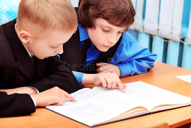 Portrait of a schoolboys in a classroom. Portrait of a schoolboys in a classroom.