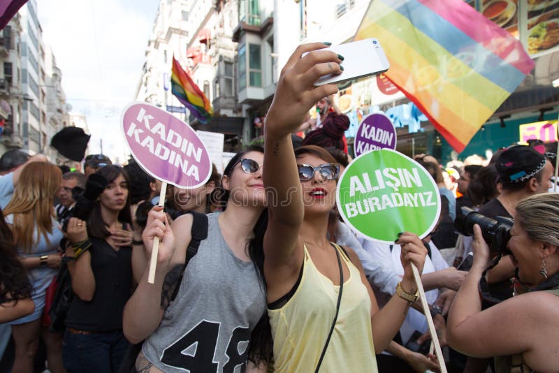 ISTANBUL, TURKEY - JUNE 29, 2014: People take selfie shot in 22. LGBTI Pride March held in Istiklal Avenue, Istanbul. ISTANBUL, TURKEY - JUNE 29, 2014: People take selfie shot in 22. LGBTI Pride March held in Istiklal Avenue, Istanbul.