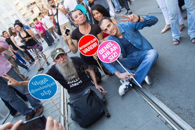 ISTANBUL, TURKEY - JUNE 29, 2014: 22. LGBTI Pride March held in Istiklal Avenue, Istanbul. Tens of thousands of people gathered to celebrate LGBT Honor week. ISTANBUL, TURKEY - JUNE 29, 2014: 22. LGBTI Pride March held in Istiklal Avenue, Istanbul. Tens of thousands of people gathered to celebrate LGBT Honor week.