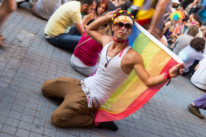 ISTANBUL, TURKEY - JUNE 29, 2014: Man in 22. LGBTI Pride March held in Istiklal Avenue, Istanbul. Tens of thousands of people gathered to celebrate LGBT Honor week. ISTANBUL, TURKEY - JUNE 29, 2014: Man in 22. LGBTI Pride March held in Istiklal Avenue, Istanbul. Tens of thousands of people gathered to celebrate LGBT Honor week.