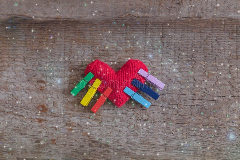 LGBT rainbow knitted heart symbol of love on wooden background, concept stock photos LGBT rainbow knitted heart symbol of love on wooden background, concept stock photos