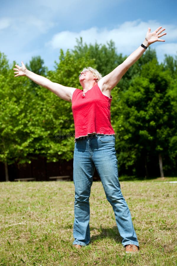 Happy elderly senior woman with freedom in nature. Happy elderly senior woman with freedom in nature