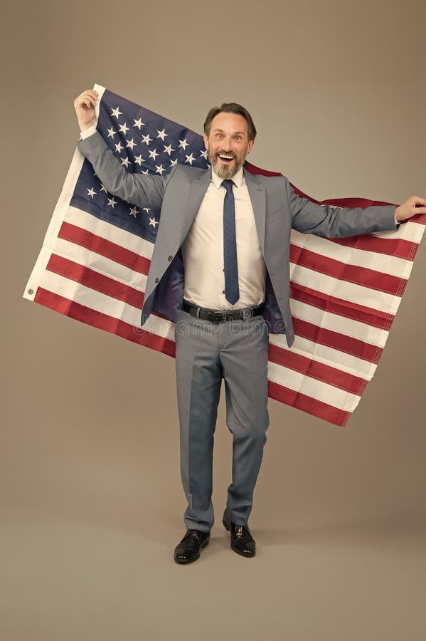 Liberty and justice for all. Patriotic businessman hold american flag. Happy man celebrate Independence day. American stock image