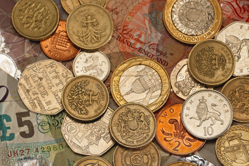 British pound sterling coins and paper money. British pound sterling coins and paper money