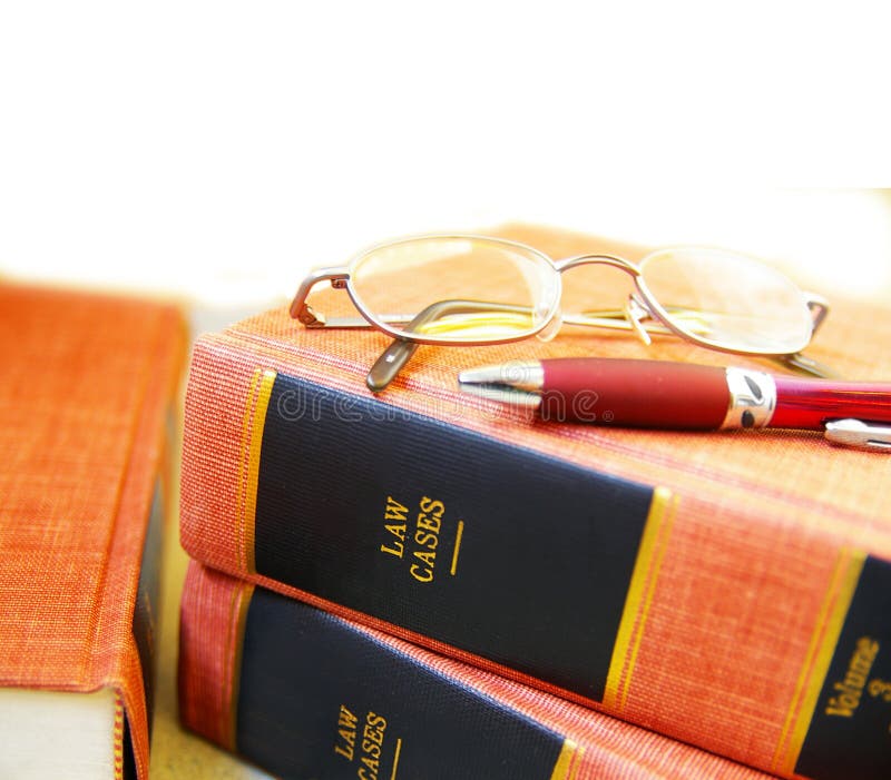 Closeup of law books, glasses and pen. Closeup of law books, glasses and pen