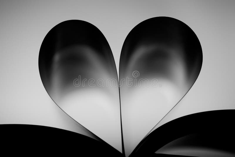 Photo Of Book With Hart Shaped Pages, Back Lit. Photo Of Book With Hart Shaped Pages, Back Lit.