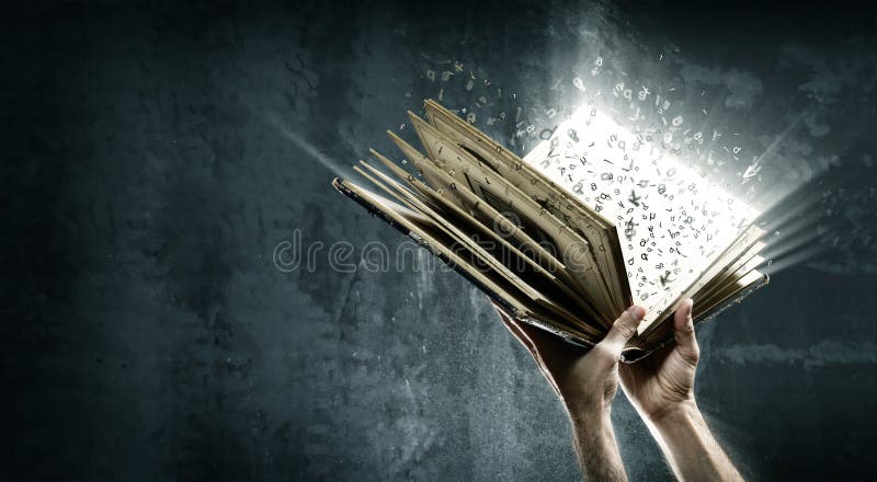 Holding magic book with flying letters. Holding magic book with flying letters