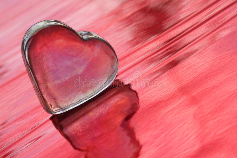 Valentine heart on the red background - the symbol of love. Valentine heart on the red background - the symbol of love