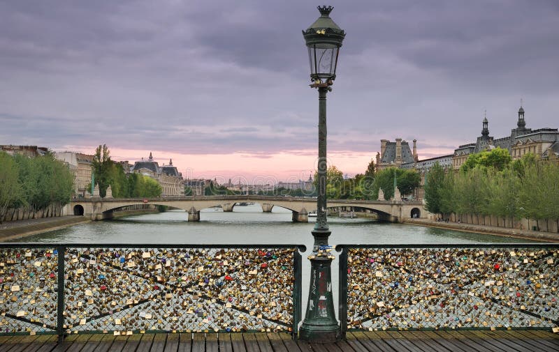 Love padlocks on the bridge Pont des Arts across river Seine in Paris, France. Love padlocks on the bridge Pont des Arts across river Seine in Paris, France.
