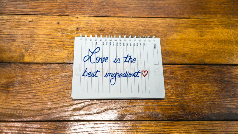 Love is the best ingredient, writing love text on paper, lovely message. Text on spiral agenda. Romantic, love concept. Valentine`s day. Love is the best ingredient, writing love text on paper, lovely message. Text on spiral agenda. Romantic, love concept. Valentine`s day