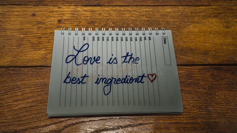 Love is the best ingredient, writing love text on paper, lovely message. Text on spiral agenda. Romantic, love concept. Valentine`s day. Love is the best ingredient, writing love text on paper, lovely message. Text on spiral agenda. Romantic, love concept. Valentine`s day