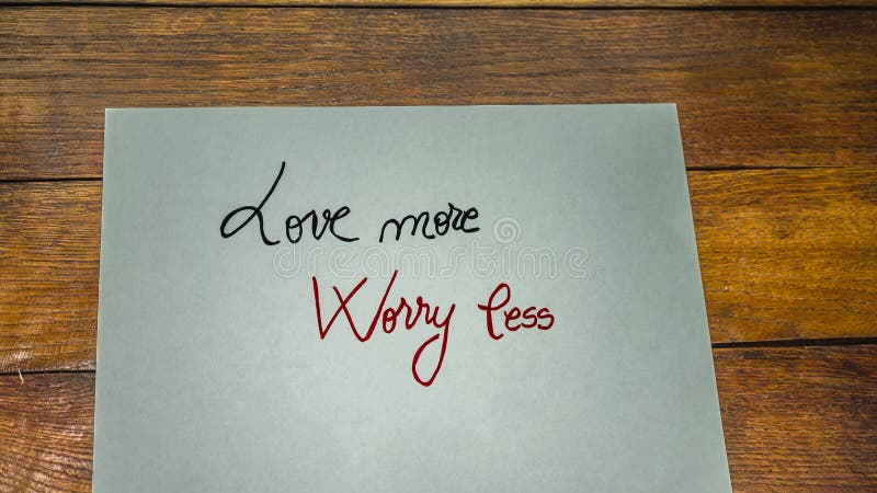 Love more, worry less, writing love text on paper, lovely message. Romantic, love concept. Valentine`s day. Love more, worry less, writing love text on paper, lovely message. Romantic, love concept. Valentine`s day