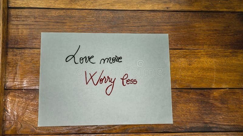 Love more, worry less, writing love text on paper, lovely message. Romantic, love concept. Valentine`s day. Love more, worry less, writing love text on paper, lovely message. Romantic, love concept. Valentine`s day