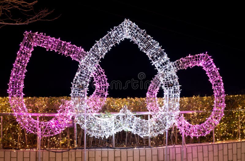 E-World in Daegu holds its Starry Night Illumination festival, a mix of rollercoasters, entertainment and covered with colored lights. the centre point is the Daegu Tower, a huge observation tower looking out over all of Daegu. three love hearts inverted pink and white with gold background. E-World in Daegu holds its Starry Night Illumination festival, a mix of rollercoasters, entertainment and covered with colored lights. the centre point is the Daegu Tower, a huge observation tower looking out over all of Daegu. three love hearts inverted pink and white with gold background