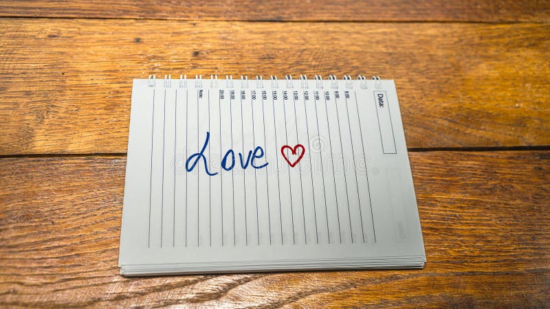 Love, writing love text on paper, lovely message. Text on spiral agenda. Romantic, love concept. Valentine`s day. Love, writing love text on paper, lovely message. Text on spiral agenda. Romantic, love concept. Valentine`s day