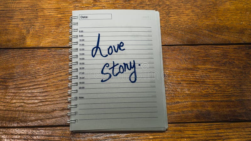 Love story, writing love text on paper, lovely message. Text on spiral agenda. Romantic, love concept. Valentine`s day. Love story, writing love text on paper, lovely message. Text on spiral agenda. Romantic, love concept. Valentine`s day