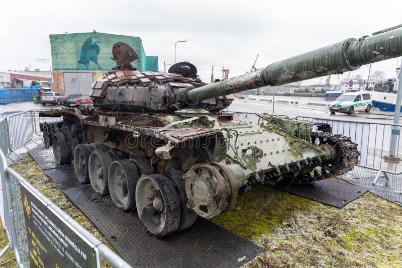 Liepaja, Latvia - 04.01.2023: Russian T-72B tank, destroyed by the Ukrainian army in the spring of 2022 in the battles near Kiev. Liepaja, Latvia - 04.01.2023: Russian T-72B tank, destroyed by the Ukrainian army in the spring of 2022 in the battles near Kiev.