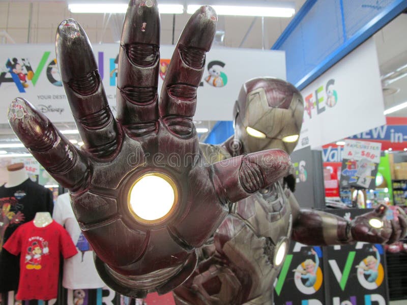 A life size Marvel hero Iron Man figure striking a pose at a departmental store mart