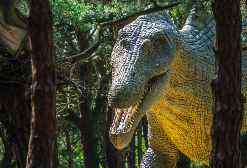 Life sized huge dinosaur statue in a forest