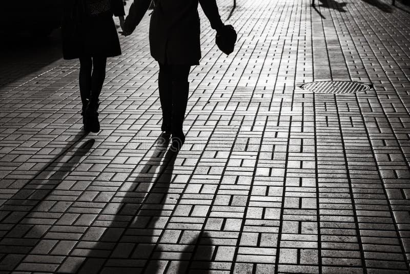 Silhouettes of people walking the streets of a big city royalty free stock images Silhouettes of people walking the streets of a big city royalty free stock images