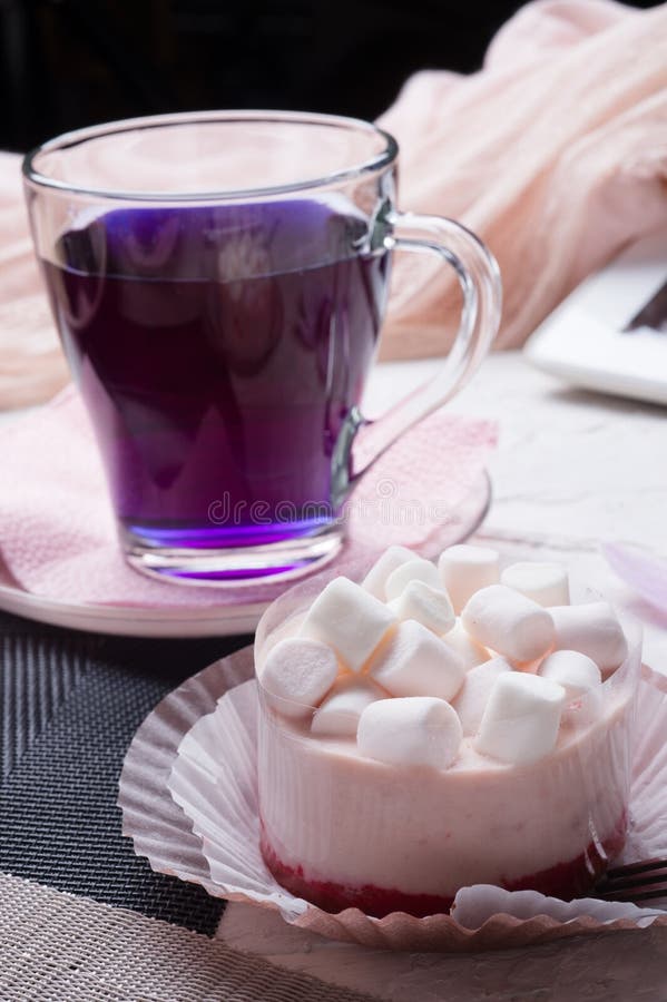 Life style set at meeting in cafe.Thai blue, Butterfly pea tea served with panna cotta cake. close up royalty free stock photo Life style set at meeting in cafe.Thai blue, Butterfly pea tea served with panna cotta cake. close up royalty free stock photo