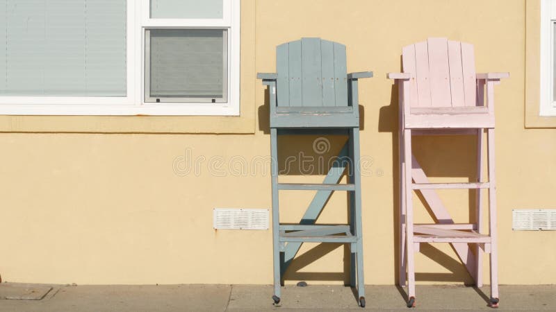 Lifeguard chairs in California USA. Life guard high seat by ocean sea beach. Los Angeles summertime.