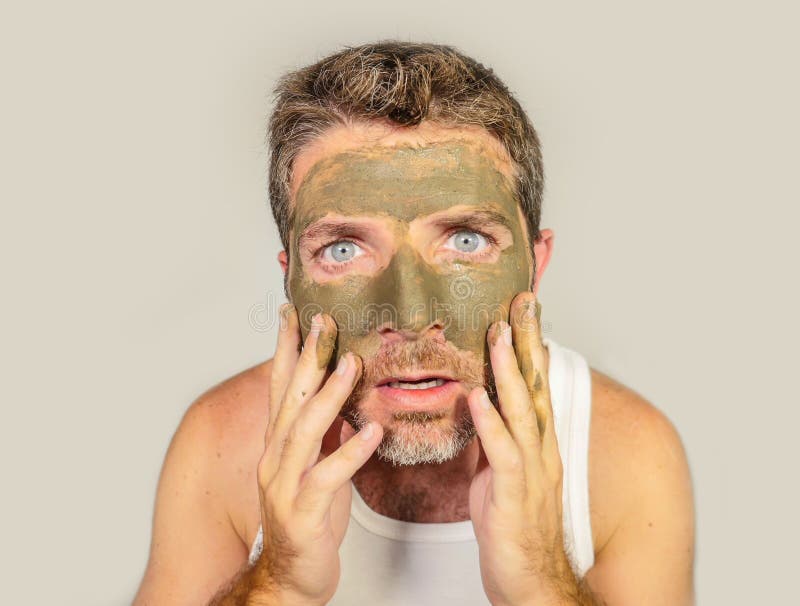 Attractive and Surprised Funny Man Horrified Looking Himself on Bathroom  Mirror Ugly and Weird Applying Green Cream on His Face I Stock Image -  Image of clay, handsome: 121335277
