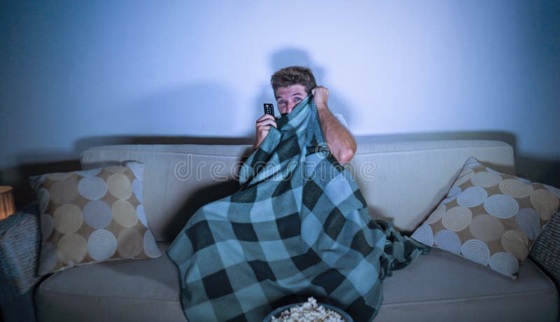 Lifestyle Portrait Of Attractive Scared And Nervous Man Watching