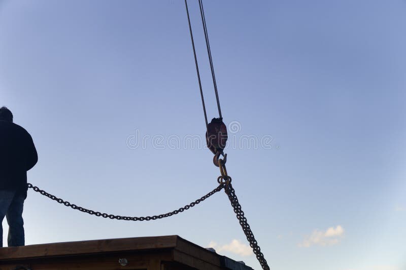 Lifting a house with crane stock photo. Image of crane 191364888