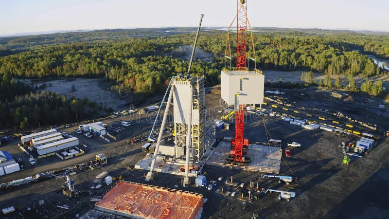 Lifting maneuver process of large pre-assembled steel structures with a lattice crane. Load structural stock images, royalty-free photos and pictures