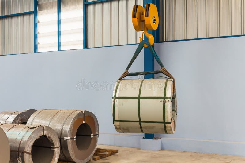 Lifting steel coil stock image