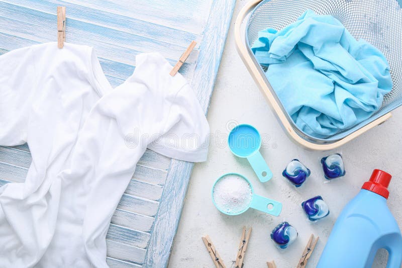 Composition with Laundry Detergents on Light Background Stock Photo